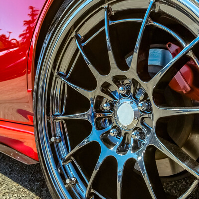 Polished Rim Of A Bright Red Car